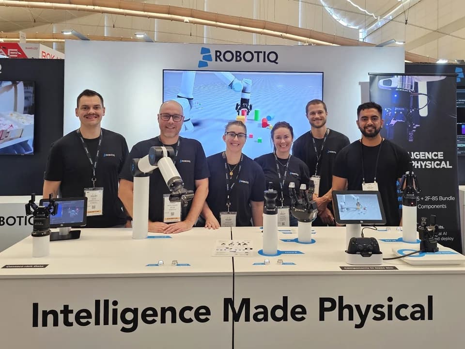 RoboLens and the Robotiq team together at the Robotiq booth at IROS 2026.
